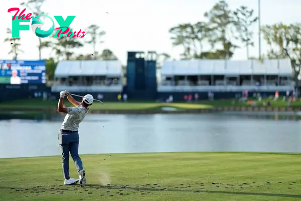 Collin Morikawa of the United States plays his shot from the 17th tee during the first round of THE PLAYERS Championship on the Stadium Course at TPC Sawgrass.
