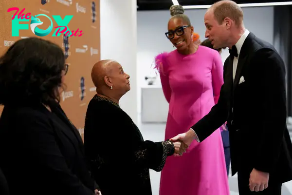 Prince William, next to Diana Award Chief Executive Tessy Ojo, shakes hands as he attends the Diana Legacy Awards.