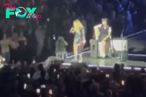Madonna calls out concertgoer in wheelchair for sitting at show.