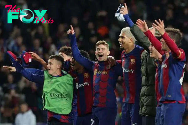 Barcelona players celebrate their win at the end of the UEFA Champions League last 16 second leg football match between FC Barcelona and SSC Napoli at the Estadi Olimpic Lluis Companys in Barcelona on March 12, 2024. (Photo by LLUIS GENE / AFP)