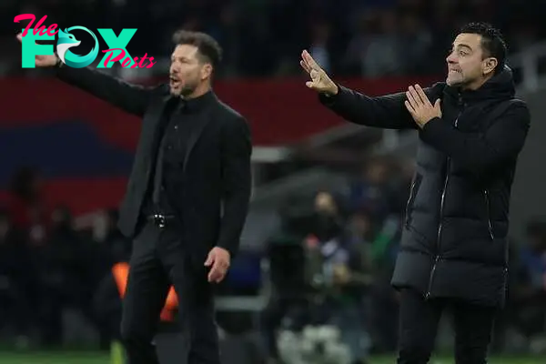 Atletico Madrid's Argentinian coach Diego Simeone (L) and Barcelona's Spanish coach Xavi gesture during the Spanish league football match between FC Barcelona and Club Atletico de Madrid at the Estadi Olimpic Lluis Companys in Barcelona on December 3, 2023. (Photo by LLUIS GENE / AFP)