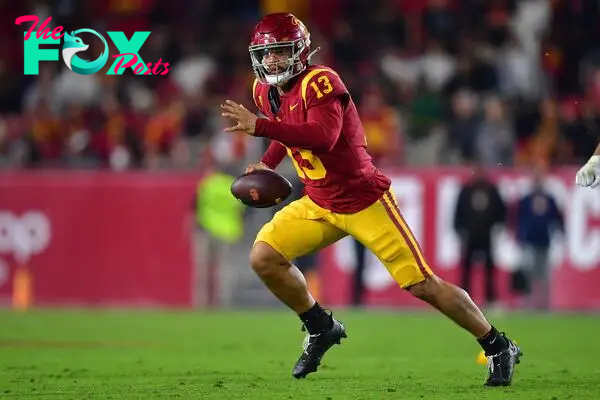 Oct 7, 2023; Los Angeles, California, USA; Southern California Trojans quarterback Caleb Williams (13) runs the ball during the second overtime against the Arizona Wildcats at Los Angeles Memorial Coliseum. Mandatory Credit: Gary A. Vasquez-USA TODAY Sports