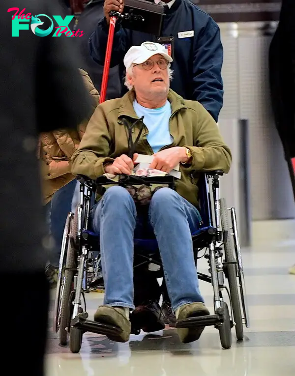 Chevy Chase in a wheelchair. 