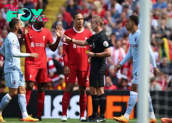 Soccer Football - Premier League - Liverpool v Aston Villa - Anfield, Liverpool, Britain - May 20, 2023 Liverpool's Ibrahima Konate is shown a yellow card by referee John Brooks as Virgil van Dijk looks on REUTERS/Phil Noble EDITORIAL USE ONLY. No use with unauthorized audio, video, data, fixture lists, club/league logos or 'live' services. Online in-match use limited to 75 images, no video emulation. No use in betting, games or single club /league/player publications.  Please contact your account representative for further details.