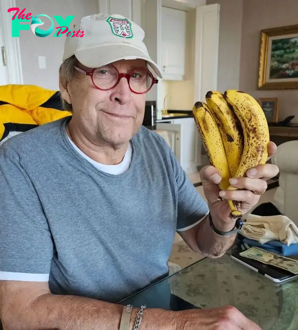 Chevy Chase holding bananas. 