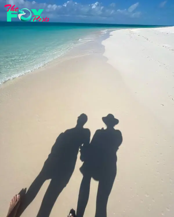 Brock Purdy and Jenna Brandt's shadows on the beach.