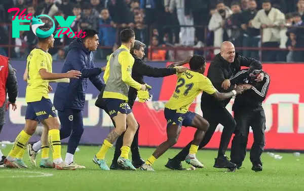 In another controversial incident in the Turkish league, Trabzonspor fans ran onto the field after their 3-2 loss and violently attacked Fenerbahce players.