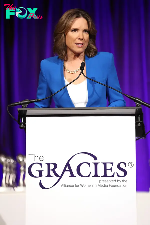 Hannah Storm speaking on stage at the 2022 Gracie Awards.