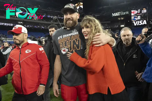 Taylor Swift and Travis Kelce celebrating after his AFC Championship NFL football game.