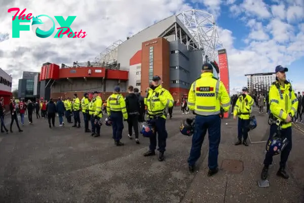MANCHESTER, ENGLAND - Sunday, March 17, 2024: Police with riot helmets seen outside the stadium before the FA Cup Quarter-Final match between Manchester United FC and Liverpool FC at Old Trafford. (Photo by David Rawcliffe/Propaganda)