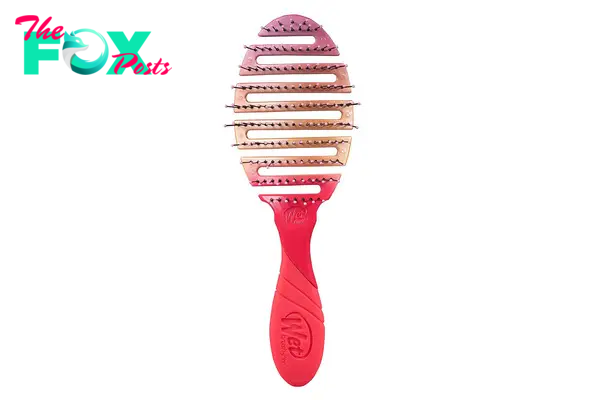 A pink and orange ombre hairbrush