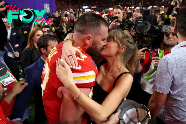 Taylor Swift and Travis Kelce kissing after his 2024 Super Bowl win.