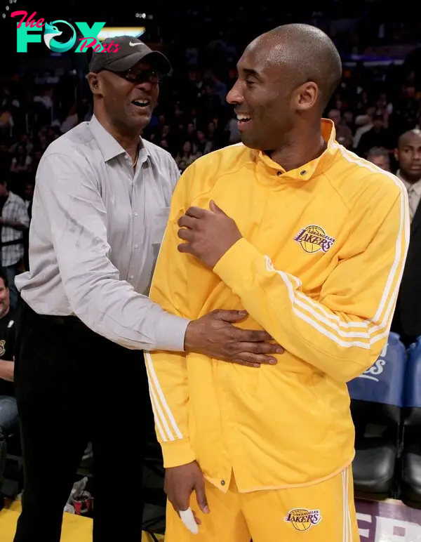 Kobe Bryant laughing with his dad, Joe Bryant, in 2010.