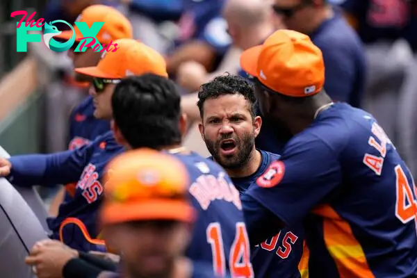 JUPITER, FLORIDA - MARCH 12: Jose Altuve #27 of the Houston Astros talks to teammates prior to a spring training game against the Miami Marlins at Roger Dean Stadium on March 12, 2024 in Jupiter, Florida.