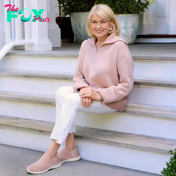 Martha Stewart in a pink sweater and sneakers