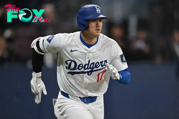 Los Angeles Dodgers' Shohei Ohtani runs to first base during the first inning of the 2024 MLB Seoul Series baseball game 2 between Los Angeles Dodgers and San Diego Padres at the Gocheok Sky Dome in Seoul on March 21, 2024. (Photo by Jung Yeon-je / AFP)