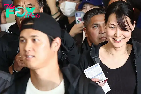 Mamiko Tanaka (R), wife of Los Angeles Dodgers Shohei Ohtani (L), arrives with the baseball team's players at Incheon International Airport in Incheon on March 15, 2024, ahead of the 2024 MLB Seoul Series baseball games between Los Angeles Dodgers and San Diego Padres. Japanese baseball superstar Shohei Ohtani on March 15 posted the first picture of his new wife, who was quickly identified online as a former basketball player named Mamiko Tanaka. (Photo by YONHAP / AFP) / - South Korea OUT / NO ARCHIVES -  RESTRICTED TO SUBSCRIPTION USE