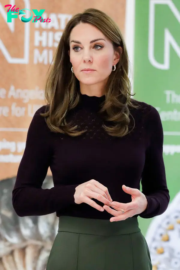 Kate Middleton in a black shirt.