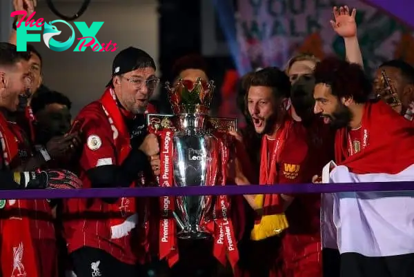 Liverpool manager Jurgen Klopp celebrates with the Premier League trophy after the Premier League match at Anfield, Liverpool. ( Laurence Griffiths/PA Wire/PA Images)