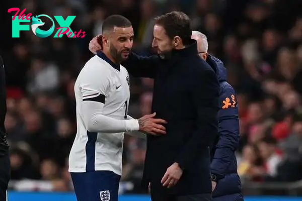 England's defender #02 Kyle Walker (L) is consoled by England's manager Gareth Southgate (R) after having to leave the game after picking up an injury during the international friendly football match between England and Brazil at Wembley stadium in north London on March 23, 2024. (Photo by Glyn KIRK / AFP) / NOT FOR MARKETING OR ADVERTISING USE / RESTRICTED TO EDITORIAL USE