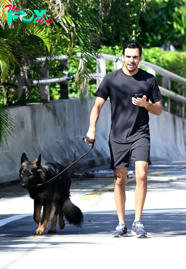 Joaquim Valente walking a dog