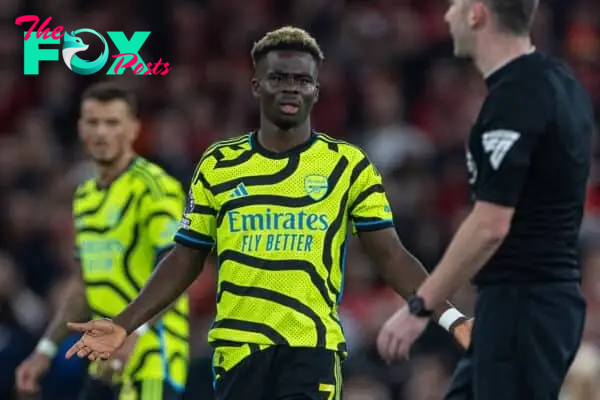LIVERPOOL, ENGLAND - Saturday, December 23, 2023: Arsenal's Bukayo Saka looks towards the referee as he escapes a second yellow card during the FA Premier League match between Liverpool FC and Arsenal FC at Anfield. (Photo by David Rawcliffe/Propaganda)