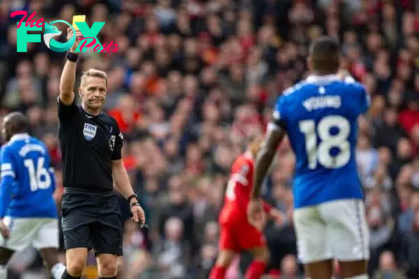 LIVERPOOL, ENGLAND - Saturday, October 21, 2023: Referee Craig Pawson shows a yellow card to Everton's Ashley Young during the FA Premier League match between Liverpool FC and Everton FC, the 243rd Merseyside Derby, at Anfield. (Photo by David Rawcliffe/Propaganda)