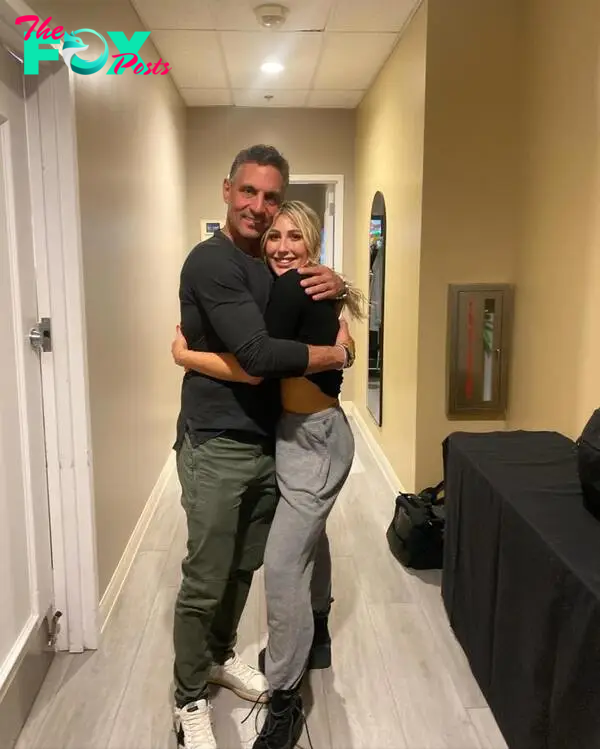 Emma Slater and Mauricio Umansky hug