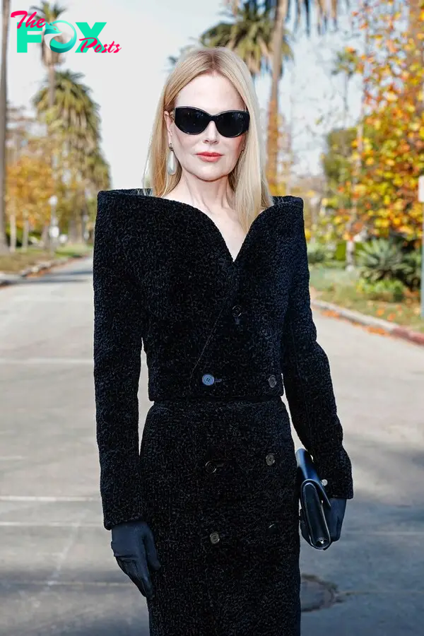 Nicole Kidman in long black coat-dress at Balenciaga '24 show.
