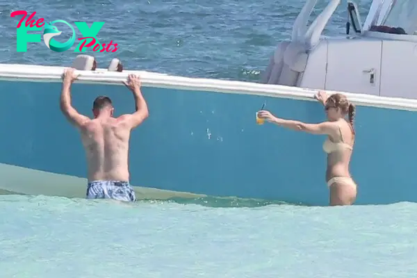 Taylor Swift and Travis Kelce on the beach in the Bahamas. 