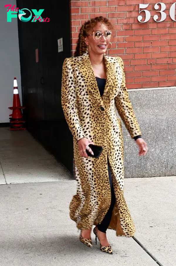 Mel B exits Drew Barrymore show wearing a leopard print trench coat in New York City.