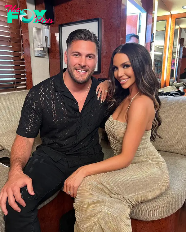 Brock Davies and Scheana Shay sitting together 