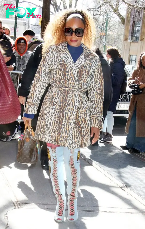 Mel B traversed the streets of NYC in a leopard print trench and multicolor white pants. She finished the look with big sunglasses and her hair in a high ponytail. 