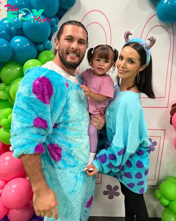 Brock Davies and Scheana shay holding their kid