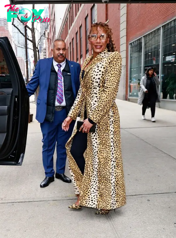 Mel B exits Drew Barrymore show wearing a leopard print trench coat in New York City.