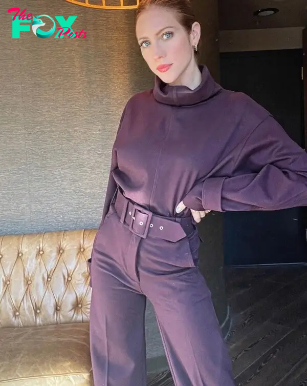 Brittany Snow in a purple outfit