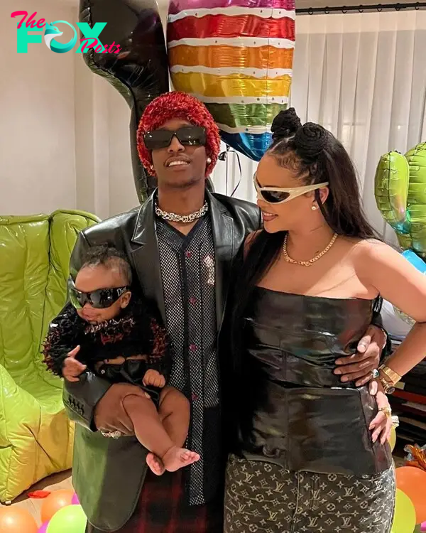 Rihanna and A$AP Rocky pose with their son. 