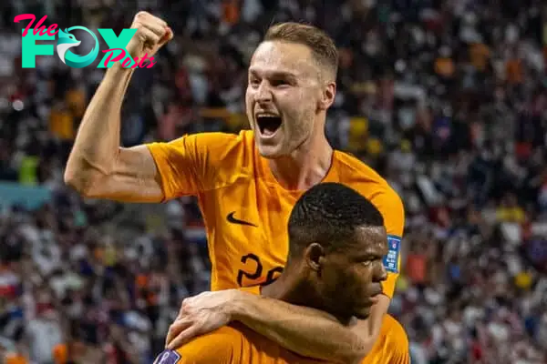 DOHA, QATAR - Saturday, December 3, 2022: Netherlands' Denzel Dumfries celebrates with team-mate Netherlands' Teun Koopmeiners (L) after scoring the third goal during the FIFA World Cup Qatar 2022 Round of 16 match between Netherlands and USA at the Khalifa International Stadium. Netherlands won 3-1. (Pic by David Rawcliffe/Propaganda)