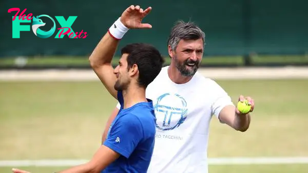 Novak Djokovic and Goran Ivanisevic joke during training at Wimbledon.