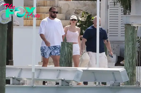 Taylor Swift and Travis Kelce holding hands in the Bahamas. 