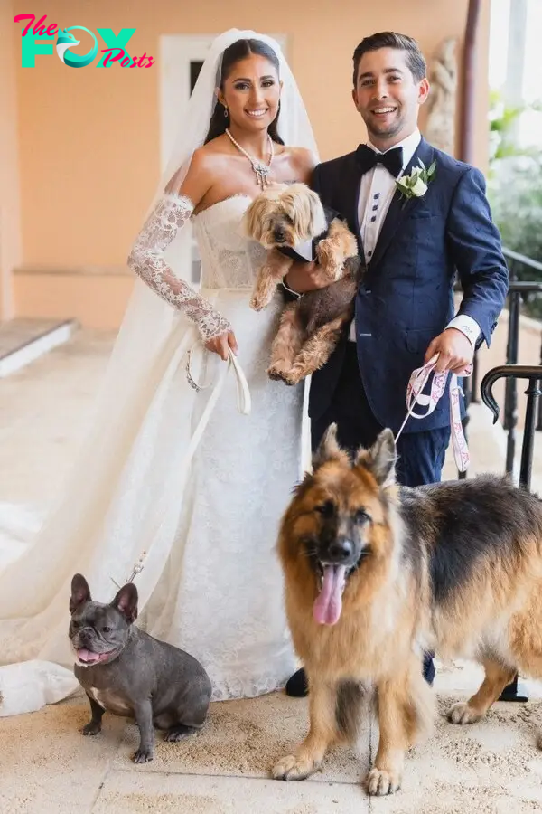 Jarod and Alexa Malnik on their wedding day with their dogs. 