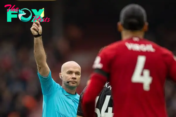 LIVERPOOL, ENGLAND - Sunday, April 9, 2023: Referee Paul Tierney shows a yellow card to Liverpool's Virgil van Dijk during the FA Premier League match between Liverpool FC and Arsenal FC at Anfield. The game ended in a 2-2 draw. (Pic by David Rawcliffe/Propaganda)