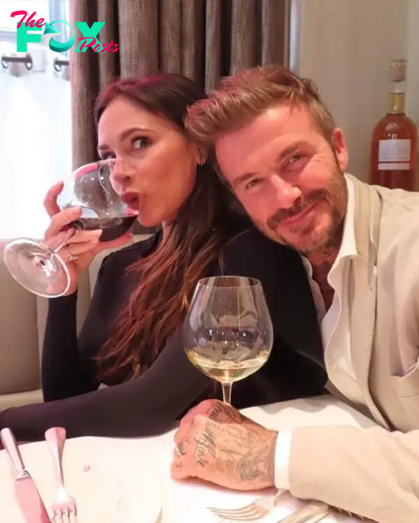 David Beckham and Victoria Beckham drinking wine.