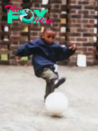 Young Aaron Wan-Bissaka playing football at an unknown location.