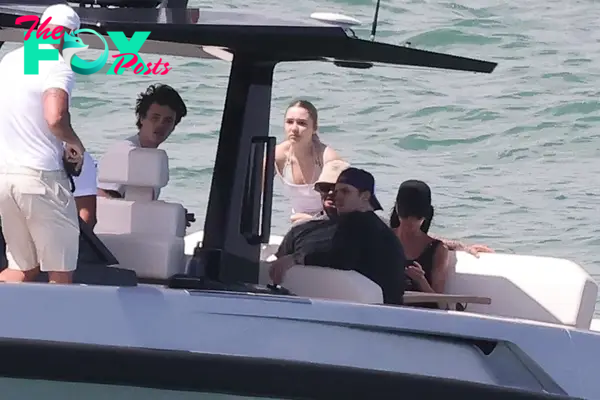 David Beckham and Victoria Beckham on a boat with their kids.