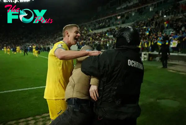 The Ukrainian captain tried (unsuccessfully) to prevent security from taking a fan off the field after they beat Iceland 2-1 in the Euro 2024 playoff match.