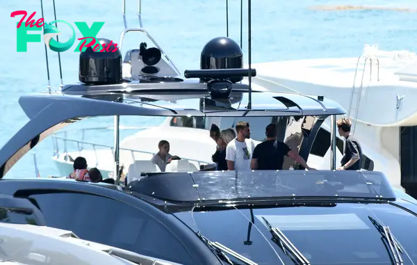 The Beckhams hanging out inside the Riva 130 Bellissima Yacht.