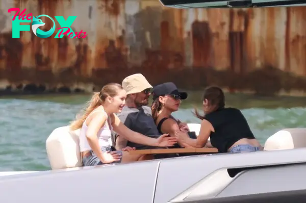 David Beckham and Victoria Beckham on a boat.