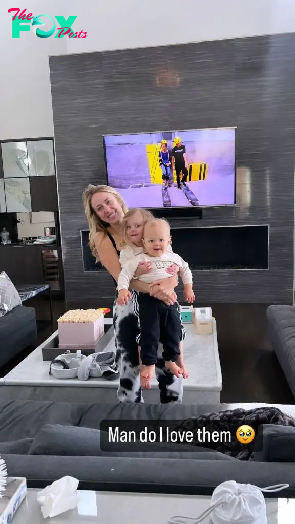 Brittany Mahomes holding her kids