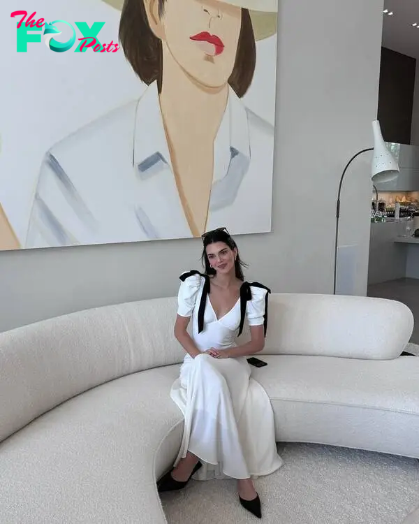 Kendall Jenner sitting on a couch